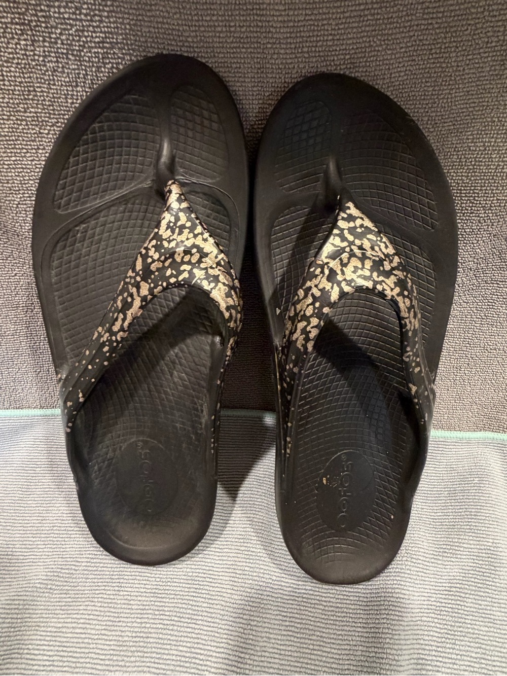 OOFOS Black Flip-Flops with Gold Speckle Straps